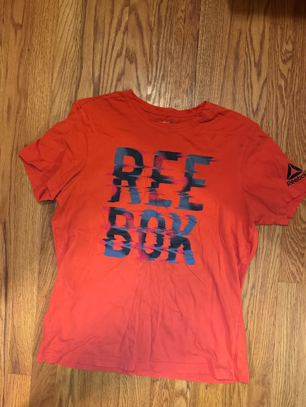 Reebok Orange Tee with Distressed Navy Logo